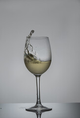 glass of white wine on the move