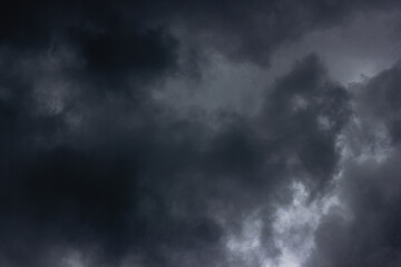 Naklejka na ściany i meble Overcast dark sky with clouds.