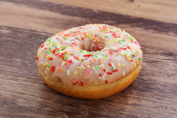 Sweet glazed vanilla donut with icing
