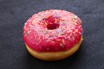 Sweet glazed struwberry donut with icing