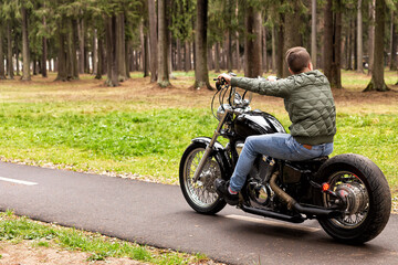 Fototapeta na wymiar A man rides a motorcycle on the road. Transport and leisure