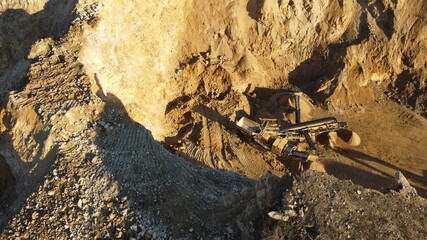 aerial view of a large quarry of yellow strong stone. high quality stone used in construction projects