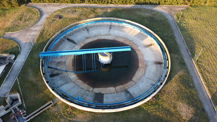 Aerial view of a wastewater treatment plant. During purification, chemicals and microorganisms are removed from the water and the water is returned to river and sea watercourses.