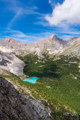 Fototapeta na wymiar Lake Sorapis Italian Dolomites, Morning with clear sky on Lago di Sorapis in Italian Dolomites, lake with unique turquoise color water in Belluno province in Nothern Italy.