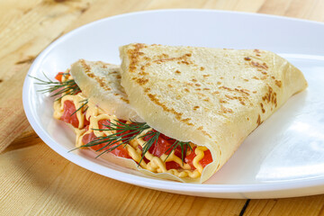 Pancake with salmon fiilet and cheese