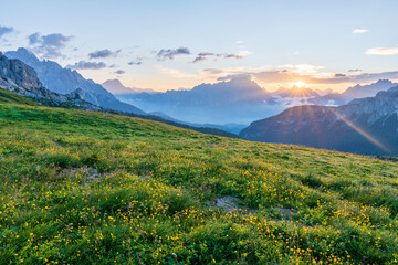 Fototapeta premium Scenic image of mountains during sunset. Amazing nature scenery of Dolomites Alps. Passo Giau popular travel destination in Dolomites. travel, adventure, concept image. Stunning natural background.