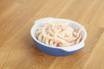 Marinated squid strips in the bowl