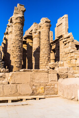Fototapeta premium EGYPT - KARNAK TEMPLE - Travel tour group wanders through Karnak Temple. Beautiful Egyptian landmark with hieroglyphics, decayed temples, obelisks, towers, and other buildings. Luxor, Egypt