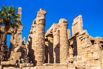  EGYPT - KARNAK TEMPLE - Large sculptures of pharaohs inside beautiful Egyptian landmark with hieroglyphics, and ancient symbols. Famous landmark in the world near Nile River and Luxor, Egypt