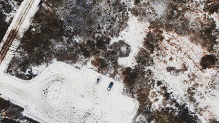 Two cars in the winter parking 
