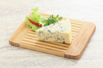 Blue cheese piece over board