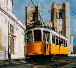 Se Lisbon Cathedral with a traditional yellow tram