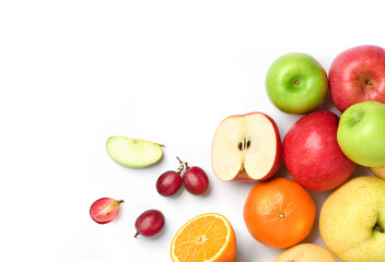 Flat lay of different fruits on white background.