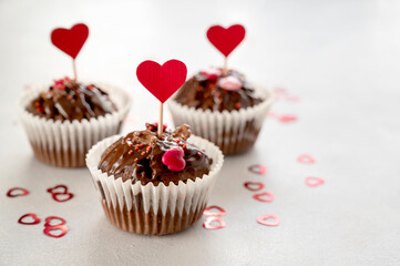 Valentine's day, chocolate homemade muffins, cupcakes with heart sprinkles.