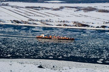 Winter Ice and Container Ship on St Lawrence River Quebec Canada