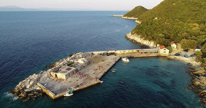 Aerial view of a small pier for ferry along the coast facing the Adriatic Sea near Lastovo, Croatia.