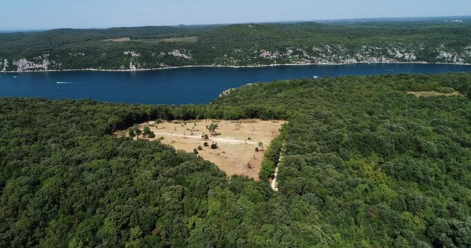 Aerial view of a deforested field along the lake near Lastovo, Croatia.