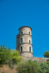 Walking on ancient french village Grimaud, touristic destination with ruines fortress castle on top, Var, Provence, France