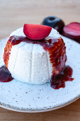 Cheese collection, white Italian soft cheese ricotta served as sweet dessert with homemade plum jam