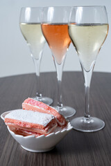 Symbols of Reims, glasses of white and rose brut champagne and rose biscuits