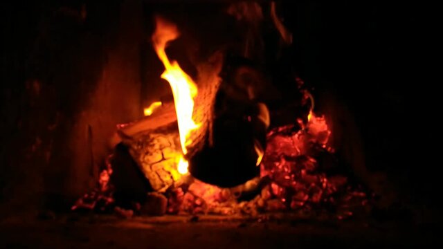 Blurred video of fire in the fireplace. Heating concept in cold weather