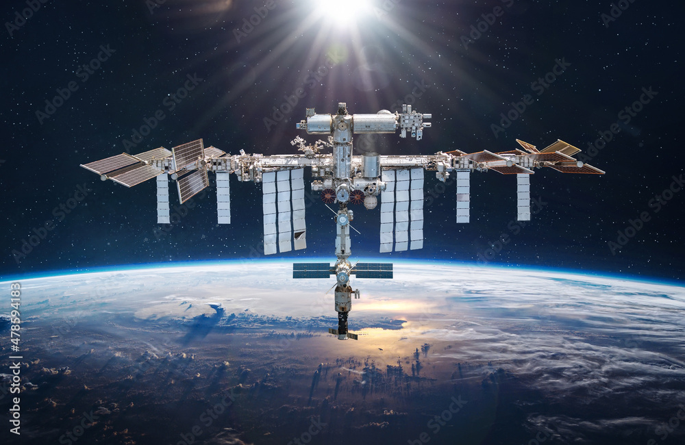 Leinwandbilder International space station in 2022 in outer space. ISS on orbit of Earth planet. Space sci-fi collage with satellite and spaceship. Astronauts on orbit. Elements of this image furnished by NASA