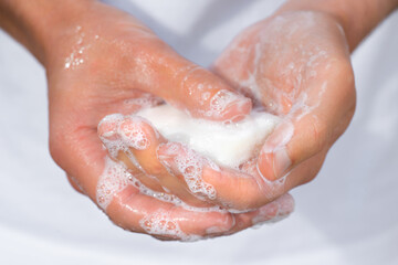 Fototapeta premium Closeup of man washing hands with soap