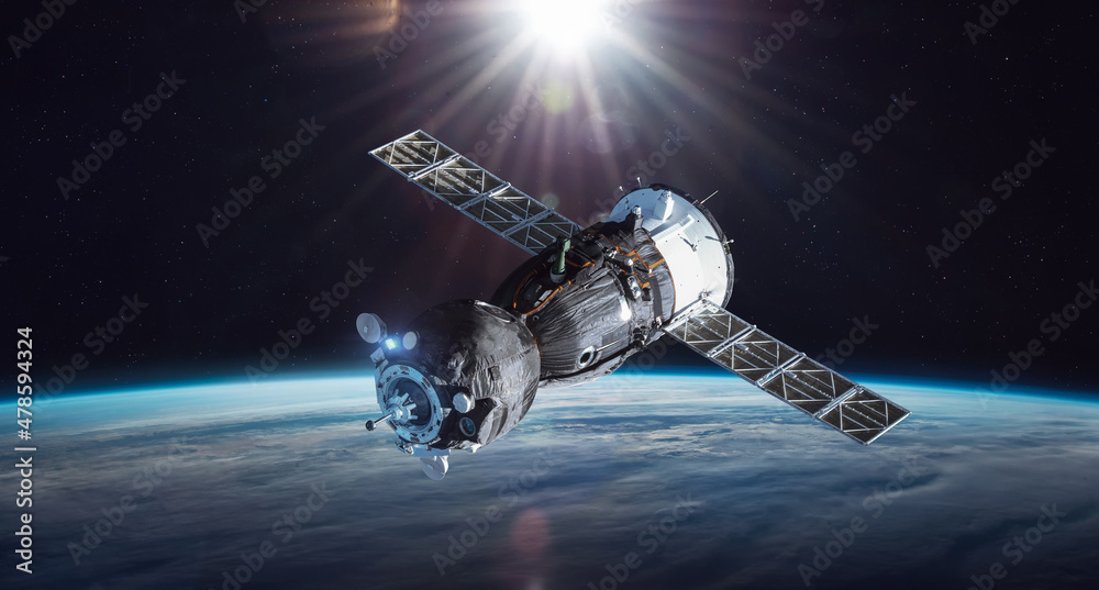 Aufkleber Russian spacecraft on orbit of Earth. Sunlight and sky with clouds on background. Spaceship in outer space. Sci-fi wallpaper. Elements of this image furnished by NASA