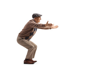 Full length profile shot of an elderly man standing with arms wide open