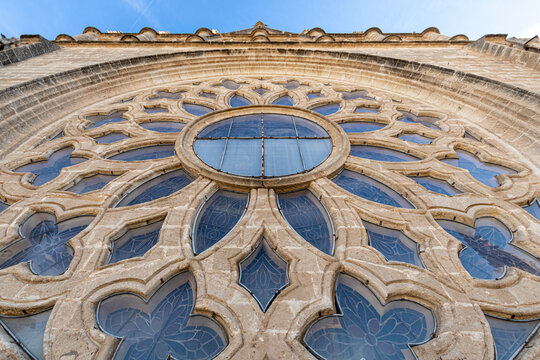 Sevilla, Spain. Closeup of the rose window of the Gothic Cathedral of Saint Mary of the See from the balcony