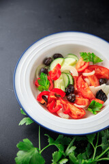vegetable salad tomato, cucumber, olives, onion, pepper fresh spring healthy meal food snack on the table copy space food background