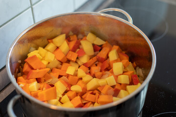 Preparation of a pumpkin puree soup in a pan