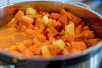 Preparation of a pumpkin puree soup in a pan