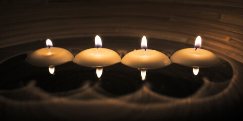 romantic floating  four candles at night