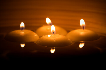 romantic floating  four candles at night