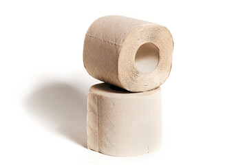 Rolls of beige toilet paper isolated on white background. Hygiene concept.