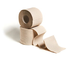 Rolls of beige toilet paper isolated on white background. Hygiene concept.