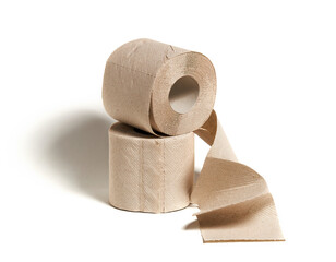 Rolls of beige toilet paper isolated on white background. Hygiene concept.