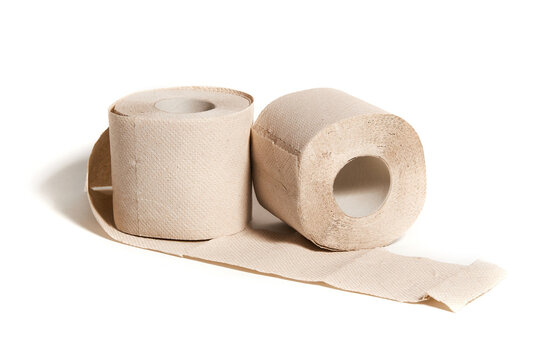 Rolls of beige toilet paper isolated on white background. Hygiene concept.