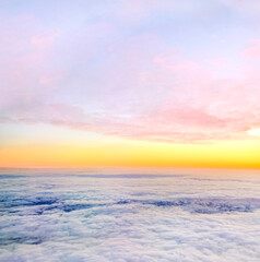 Clouds and sky background, bird's eye view at sunset, dawn, beautiful atmospheric pastel background