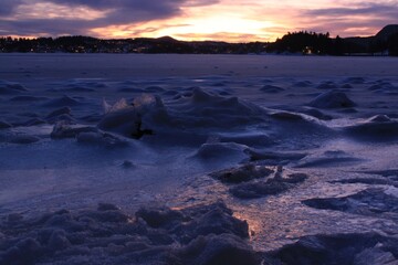 Fototapeta na wymiar sunset over the frozen fjord - Bærum
