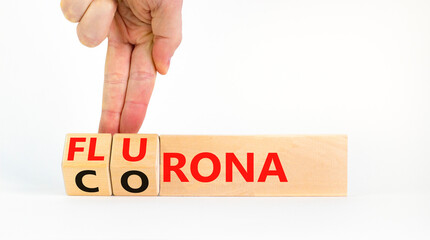 Covid-19 corona and flu flurona symbol. Doctor turns cubes and changes the word corona to flurona. Beautiful white background. Medical, covid-19 corona and flu flurona concept. Copy space.