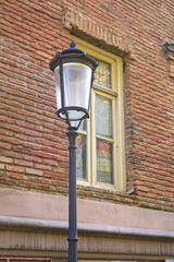 Fototapeta na wymiar Vintage lantern on brick wall background