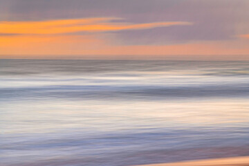 Fototapeta na wymiar A panning abstract sunrise at the seaside