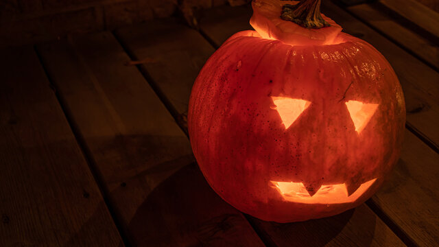 A close up of a jack-o-lantern pumpkin at halloween.