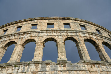 Obraz premium Pula, Istria, Croatia: Ancient amphitheater from Roman era in city centre. Monument. Cultural heritage and famous landmark. Pulska Arena