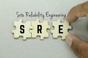 Wooden puzzle with the word site reliability engineering
