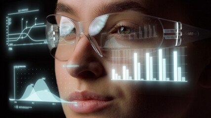 Technological glasses displaying graphs with important economical statistics 