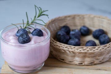 Fresh blueberry yogurt in a clear glass