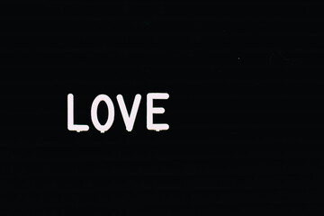 love word on black background